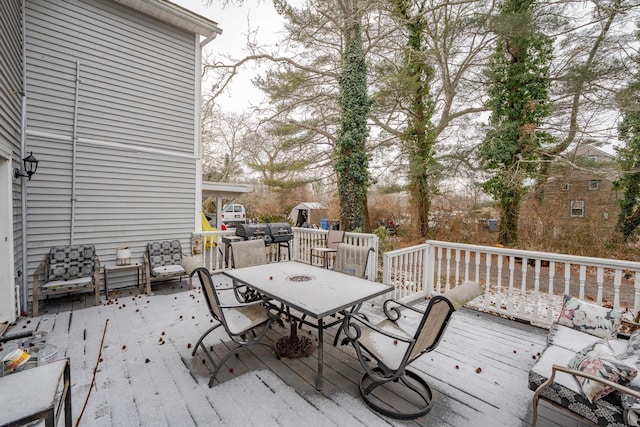 deck with outdoor dining area