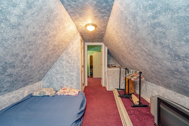 carpeted bedroom featuring lofted ceiling