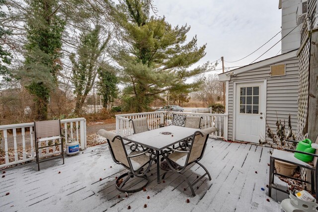 wooden deck with outdoor dining space