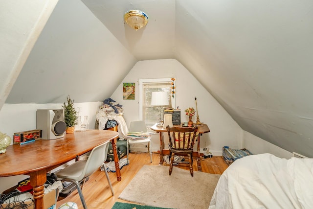 bonus room featuring vaulted ceiling and wood finished floors