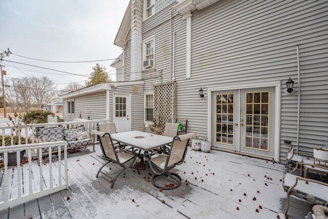 deck featuring french doors and outdoor dining area