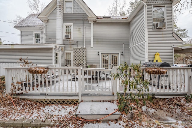 rear view of property featuring a deck