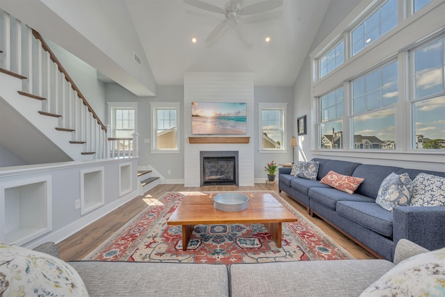 243 87th St, Stone Harbor, NJ 08247 - living area featuring high vaulted ceiling, stairs, wood finished floors, healthy amount of natural light, and a ceiling fan