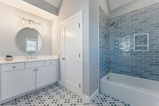 bathroom with vanity and tiled shower / bath