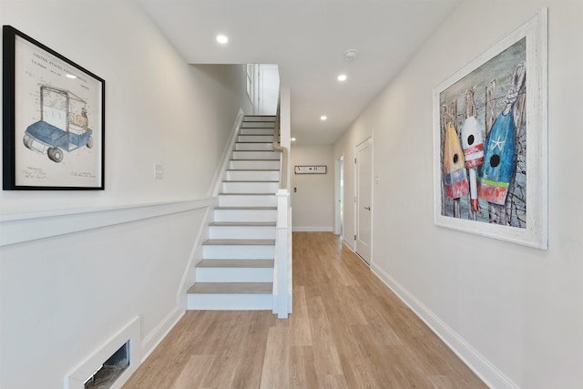 stairway featuring hardwood / wood-style flooring