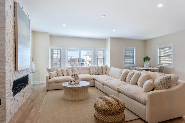 living room featuring a fireplace and light hardwood / wood-style floors