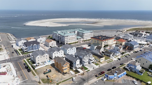 bird's eye view featuring a water view and a view of the beach