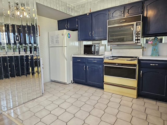 kitchen with electric stove and white refrigerator