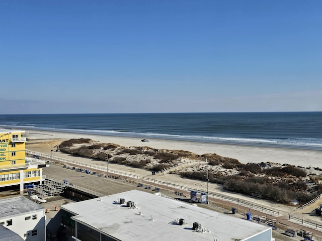 birds eye view of property with a beach view and a water view