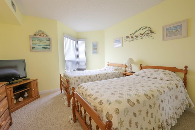 bedroom with light colored carpet