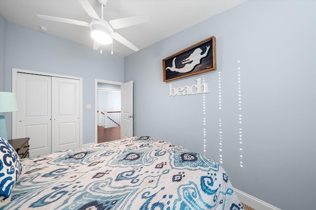 bedroom featuring ceiling fan and a closet