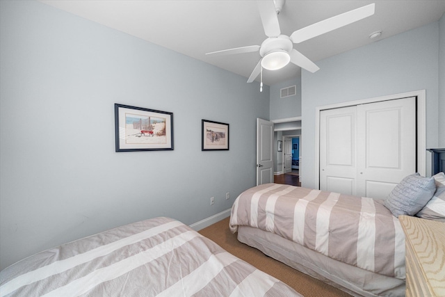 bedroom with carpet, a closet, and ceiling fan