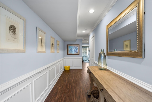 corridor featuring dark hardwood / wood-style floors and ornamental molding