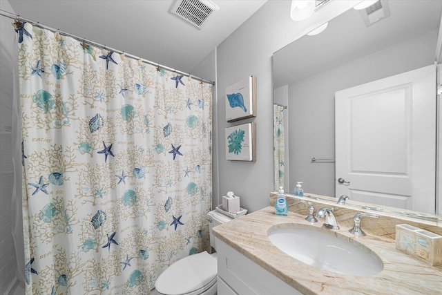 bathroom featuring vanity, a shower with shower curtain, and toilet