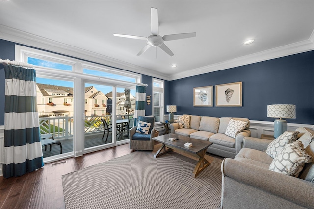 living room featuring ceiling fan, dark hardwood / wood-style flooring, and ornamental molding