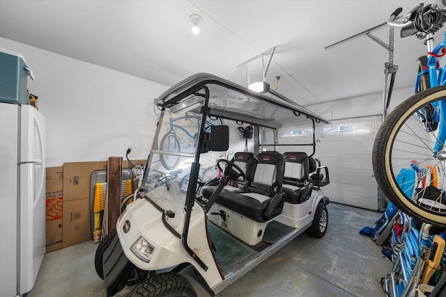 garage featuring white fridge