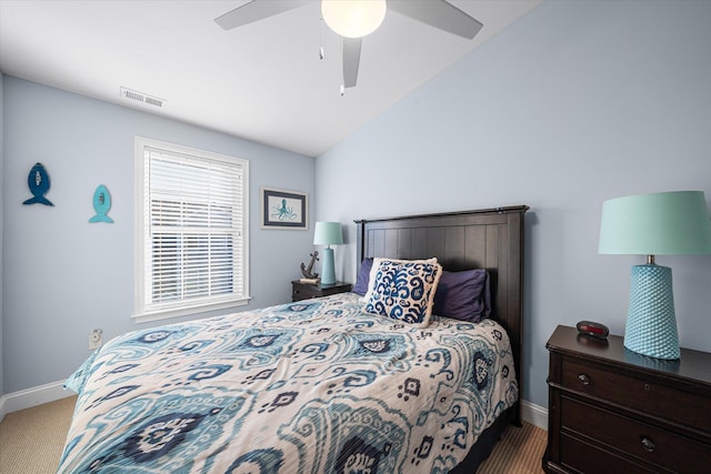 carpeted bedroom featuring ceiling fan and vaulted ceiling