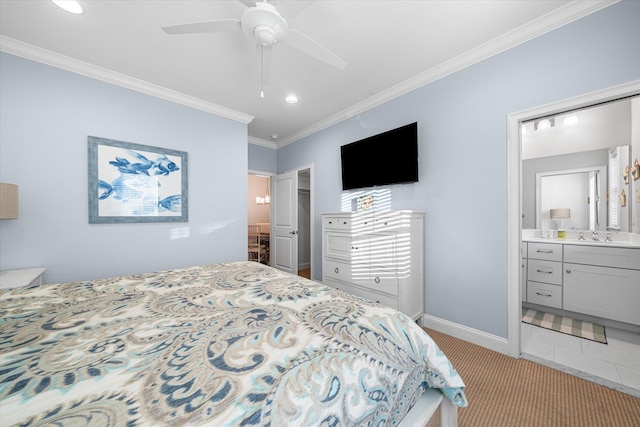 bedroom featuring ceiling fan, crown molding, light carpet, and ensuite bath