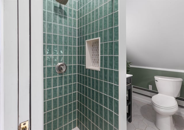 bathroom featuring tiled shower, toilet, tile patterned floors, baseboard heating, and vanity