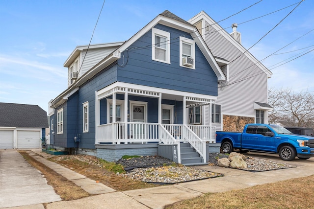 view of front facade featuring a detached garage, a chimney, covered porch, cooling unit, and an outdoor structure