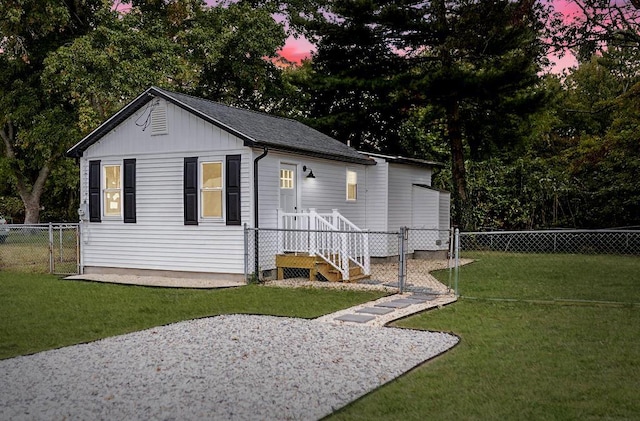 exterior space with a fenced backyard and a gate