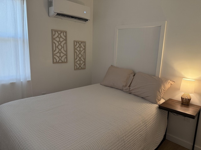 bedroom with a wall mounted AC