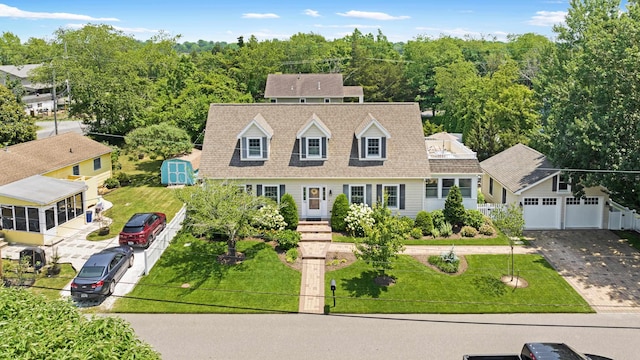 735 Maple Ave, West Cape May, NJ 08204 - view of front of property featuring a garage, driveway, roof with shingles, and an outdoor structure