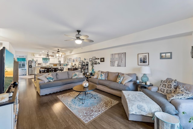 living room with dark hardwood / wood-style flooring