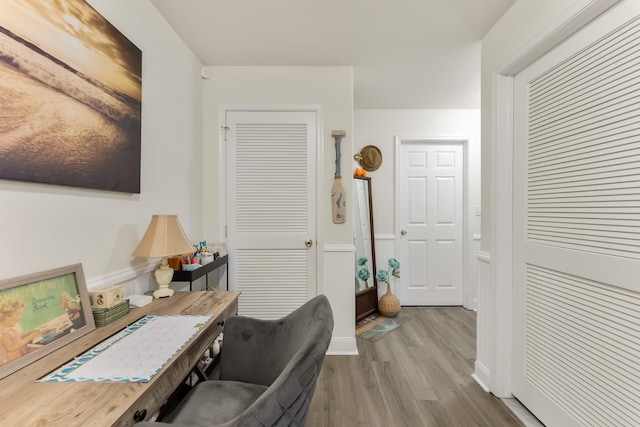 home office with wood-type flooring