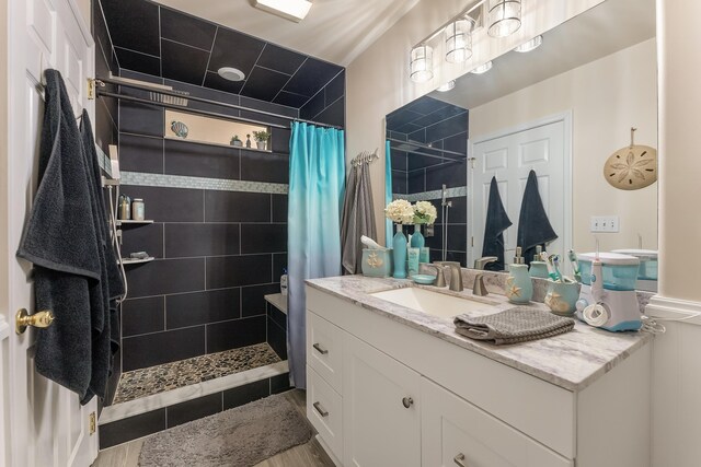 bathroom with vanity and a shower with shower curtain