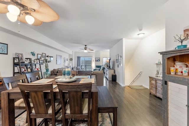 dining room with ceiling fan and dark hardwood / wood-style floors