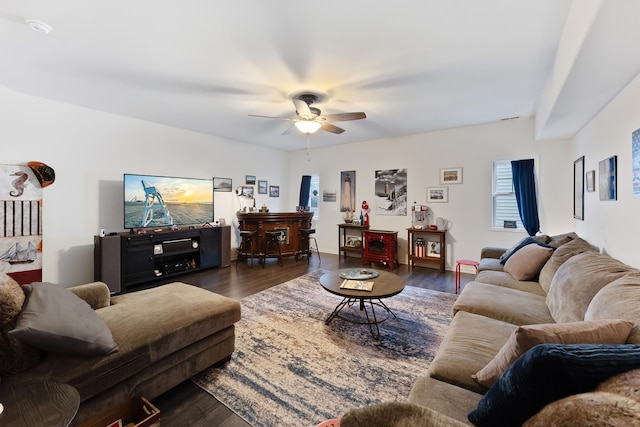 living room with ceiling fan and dark hardwood / wood-style floors