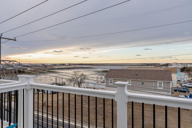 view of balcony at dusk