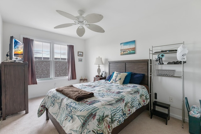 bedroom with ceiling fan and light colored carpet