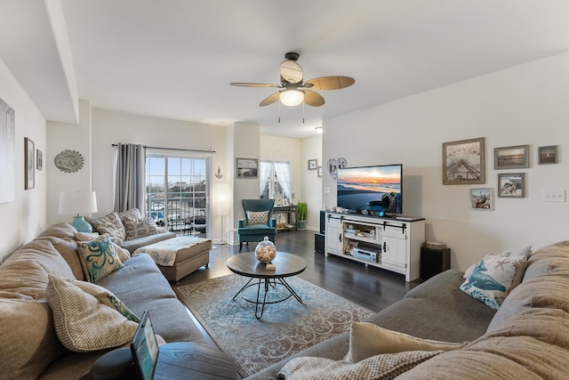 living room with ceiling fan and dark hardwood / wood-style floors