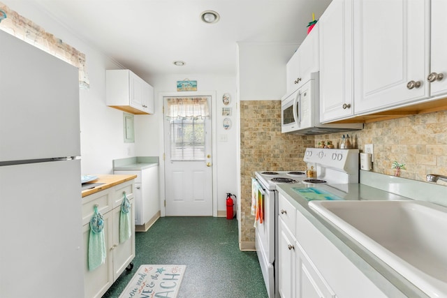 214 W 12th Ave, North Wildwood, NJ 08260 - kitchen featuring white appliances, light countertops, white cabinetry, decorative backsplash, and recessed lighting