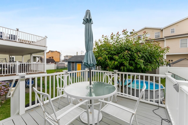 214 W 12th Ave, North Wildwood, NJ 08260 - deck with a storage shed, a fenced backyard, outdoor dining space, and a residential view
