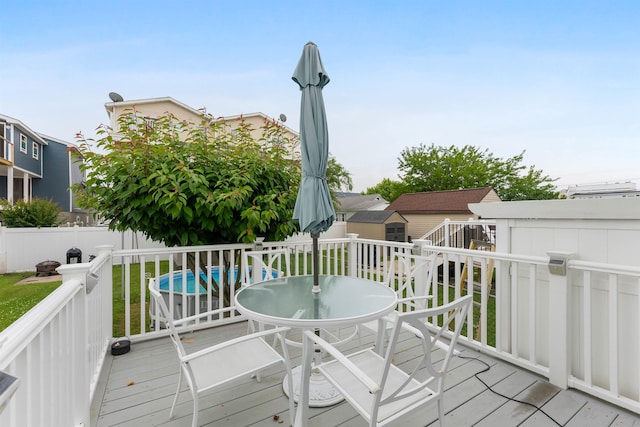 214 W 12th Ave, North Wildwood, NJ 08260 - wooden deck featuring outdoor dining space and a fenced backyard