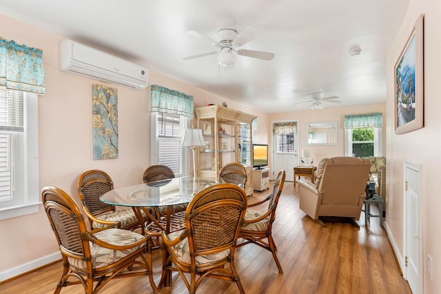214 W 12th Ave, North Wildwood, NJ 08260 - dining area with an AC wall unit, a ceiling fan, and light wood-type flooring