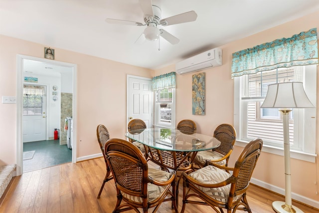 214 W 12th Ave, North Wildwood, NJ 08260 - dining room with a wall mounted air conditioner, light wood finished floors, and plenty of natural light