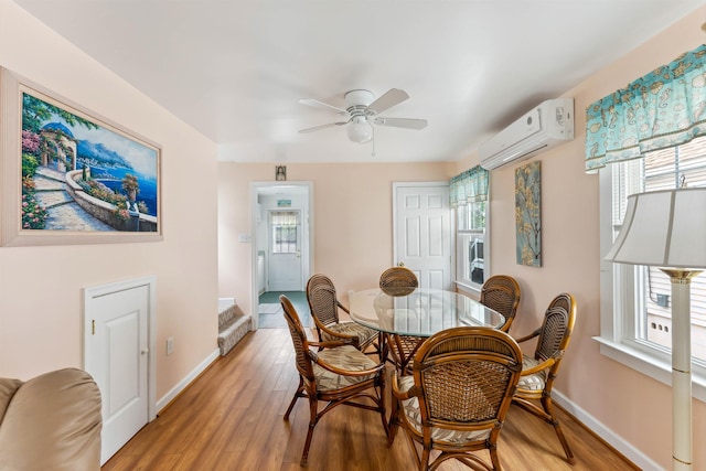 214 W 12th Ave, North Wildwood, NJ 08260 - dining space featuring a wall mounted air conditioner, healthy amount of natural light, and light wood-style floors