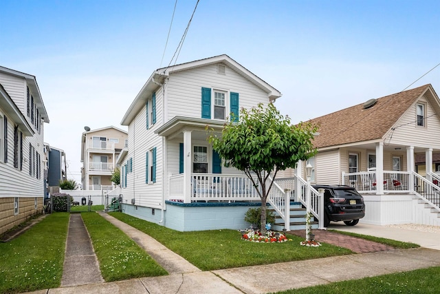 214 W 12th Ave, North Wildwood, NJ 08260 - view of front of property with covered porch and a front lawn