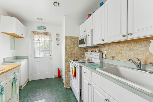 214 W 12th Ave, North Wildwood, NJ 08260 - kitchen with white appliances, white cabinets, and tasteful backsplash