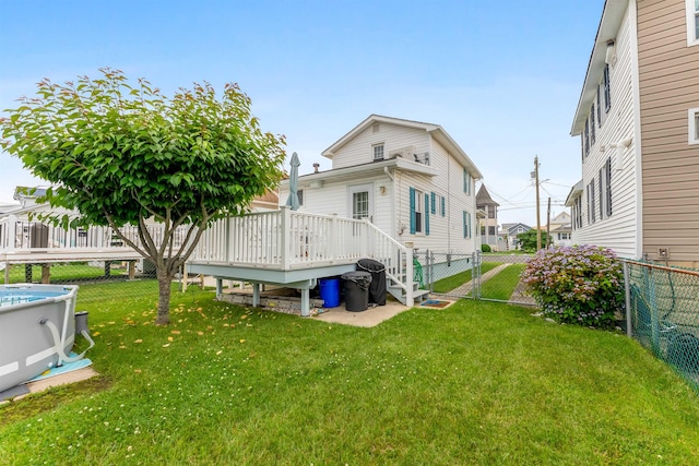 214 W 12th Ave, North Wildwood, NJ 08260 - back of house featuring a wooden deck, a fenced backyard, and a gate