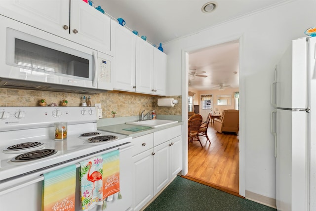214 W 12th Ave, North Wildwood, NJ 08260 - kitchen with white appliances, white cabinetry, backsplash, and a ceiling fan