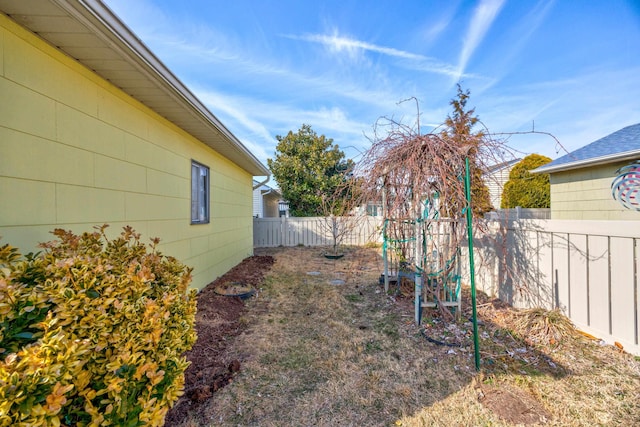 view of yard with a fenced backyard