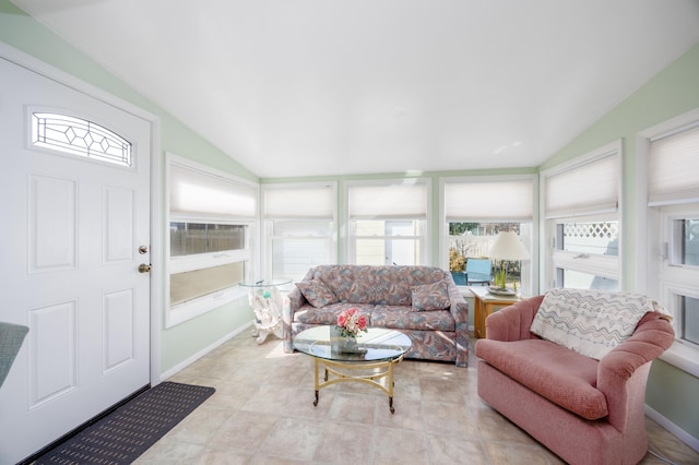 sunroom featuring vaulted ceiling