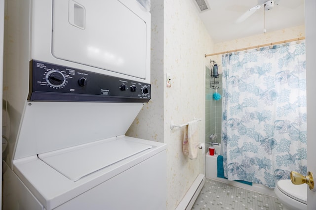 laundry room featuring stacked washer and dryer, laundry area, light tile patterned floors, visible vents, and wallpapered walls