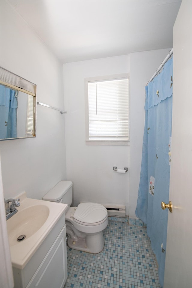 bathroom with tile patterned flooring, a shower with curtain, toilet, a baseboard heating unit, and vanity