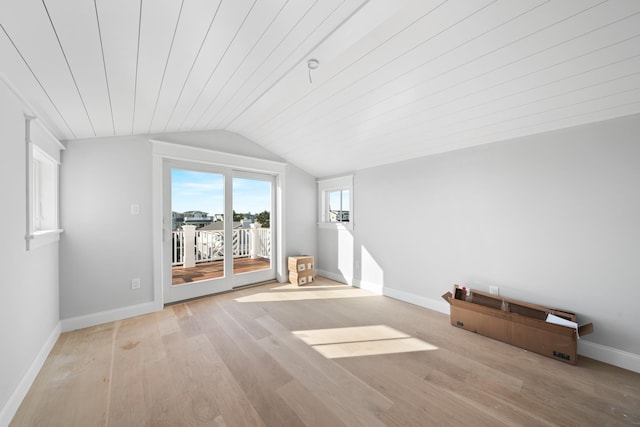 bonus room featuring lofted ceiling and light wood-type flooring